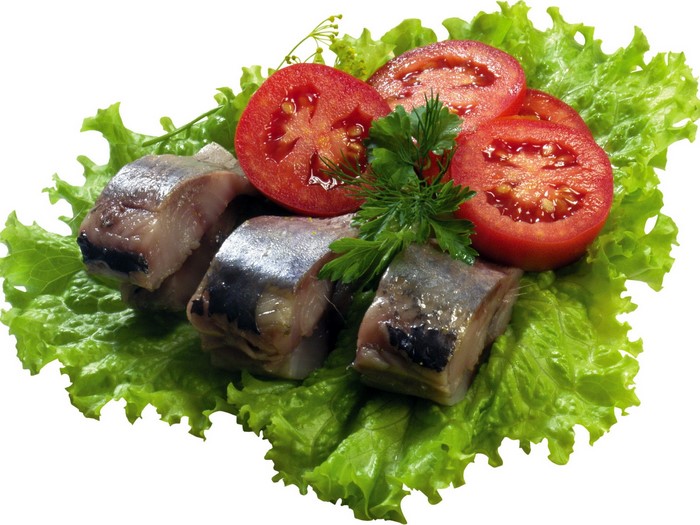 Herring, tomatoes, and lettuce on a white background