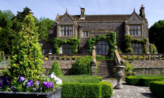 Stone manor house with formal gardens in the UK