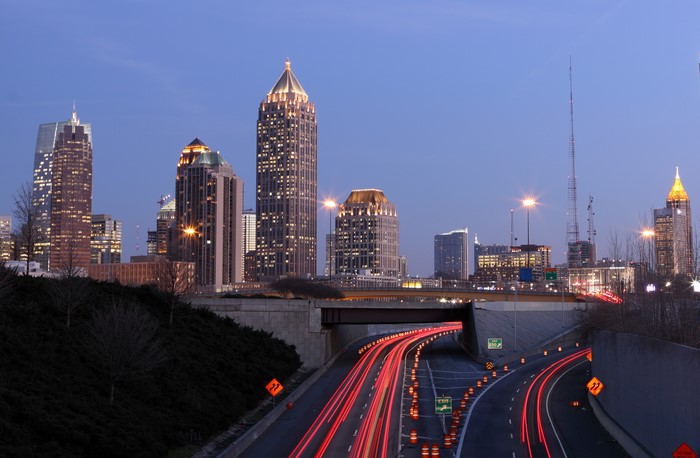 Atlanta skyline at dusk with light trails on highway