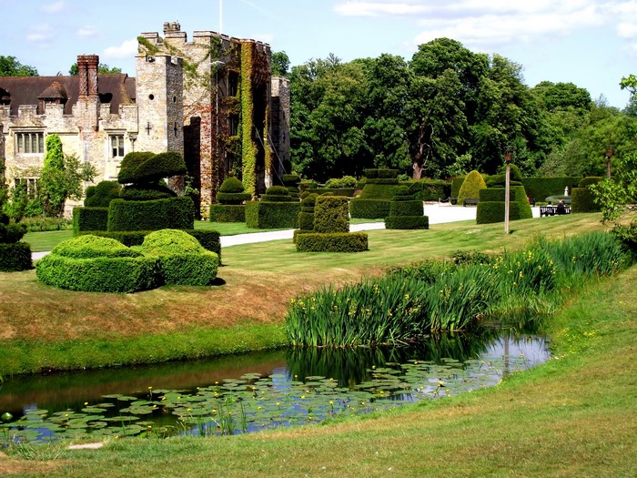 Hever Castle Gardens UK with topiary and moat