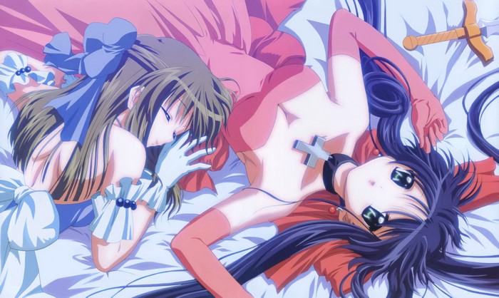 Two girls lying on a bed