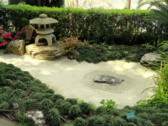 Zen garden with stone lantern and raked sand