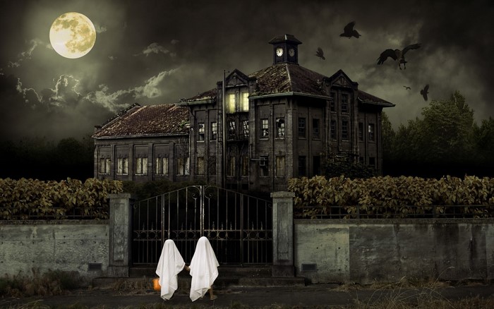 Halloween night at a haunted mansion with ghosts