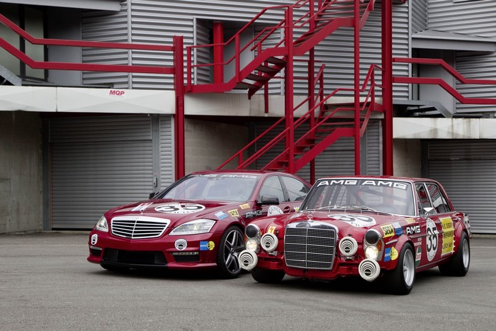 Two Mercedes-Benz AMG race cars on a track