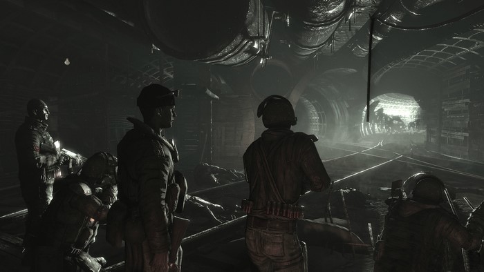 Soldiers in a dark subway tunnel in Metro 2033
