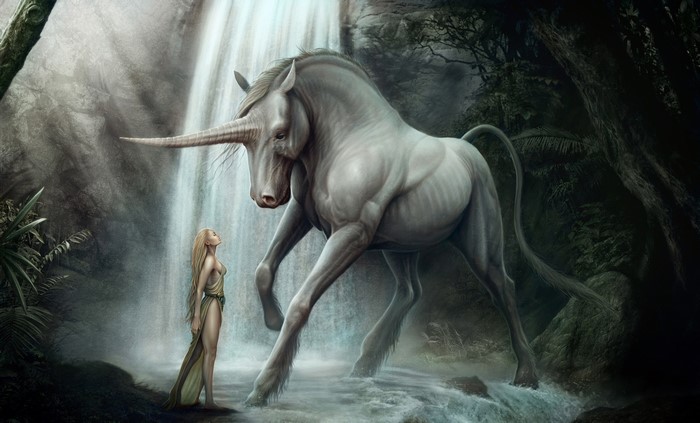 Unicorn and woman by a waterfall