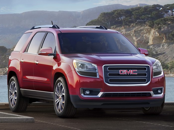 Red GMC Acadia SUV parked outdoors