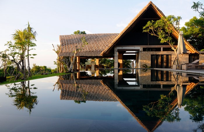 Resort bungalow with infinity pool and reflection