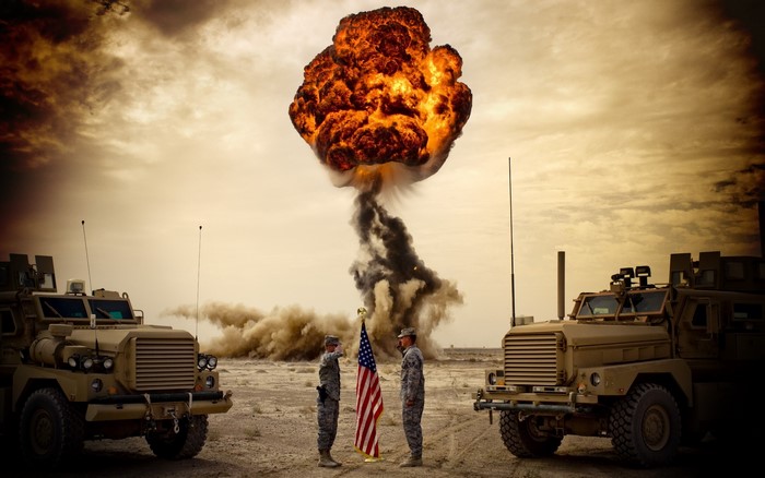 Soldiers and explosion in desert