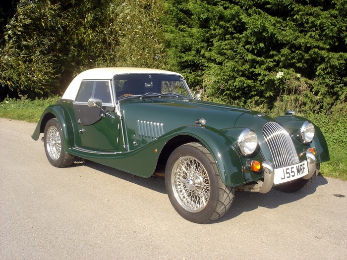Green Morgan Aero 8 convertible car on a road