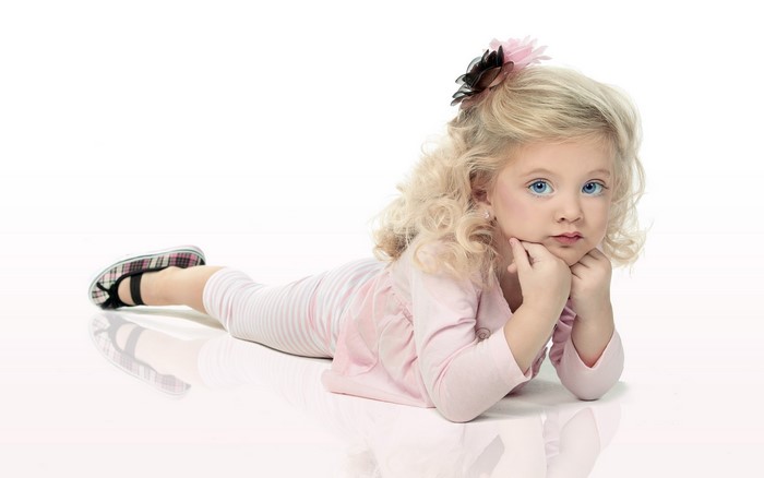 Little girl with blue eyes and blonde curly hair