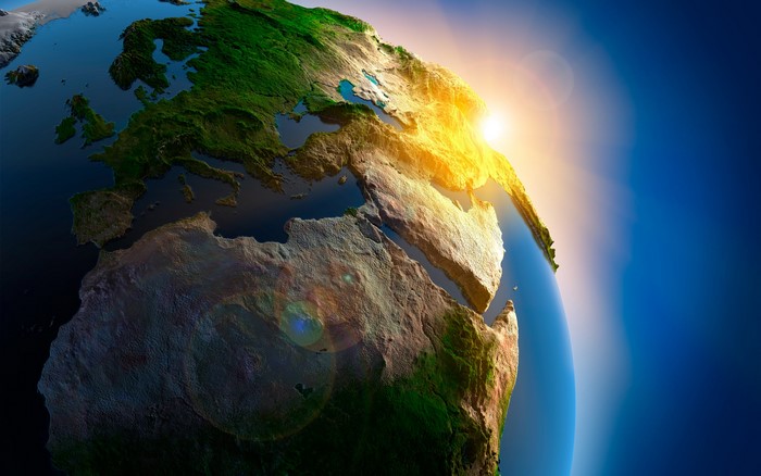 Earth from space with sunrise over Europe and Africa