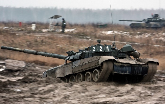 Tanks on a muddy training ground