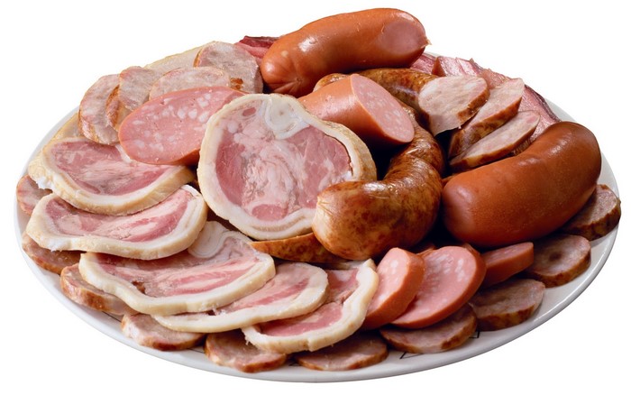 Assortment of sliced meats and sausages on a plate