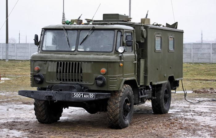 Green military truck with equipment
