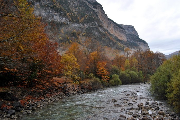 Mountain valley with a river in autumn