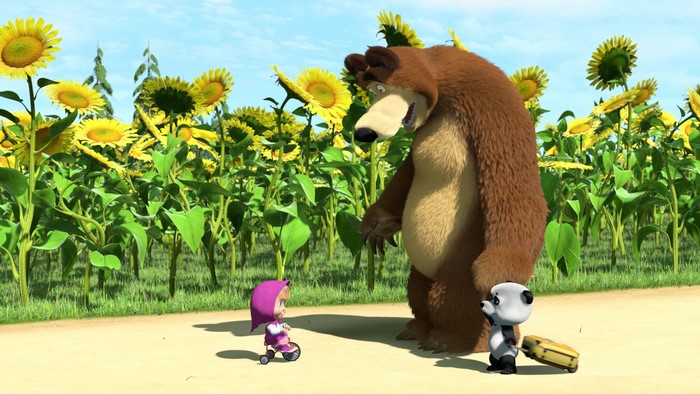 Masha and the Bear in a sunflower field