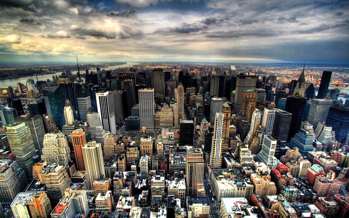 New York City Skyline with River and Clouds