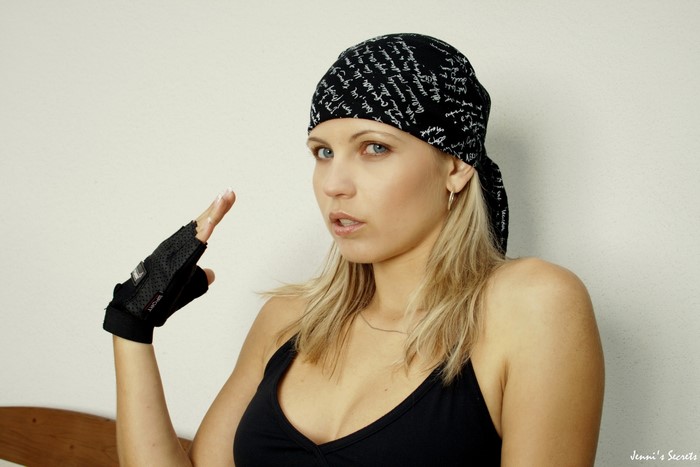 Jenni Gregg wearing a bandana and singlet