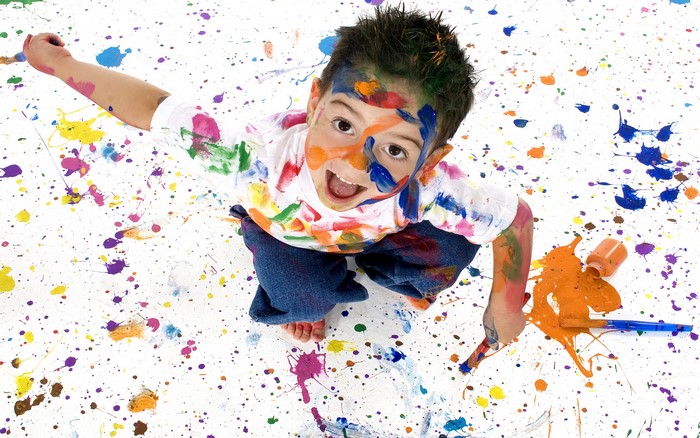 Boy covered in paint