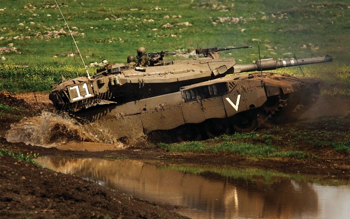 Merkava tank driving through water