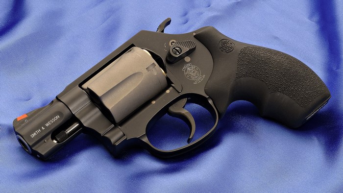 Smith & Wesson Revolver on Blue Fabric