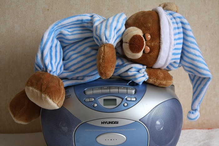 Teddy bear on a Hyundai portable stereo radio cassette recorder