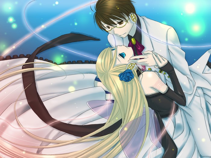 Young man holding a woman with blonde hair
