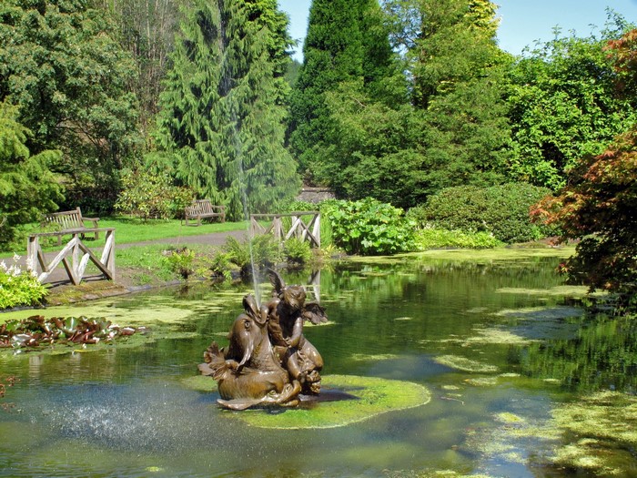 Bronze fountain sculpture in a park pond