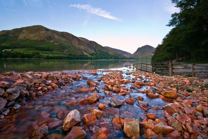 Rocky stream flowing into a lake in the Lake District