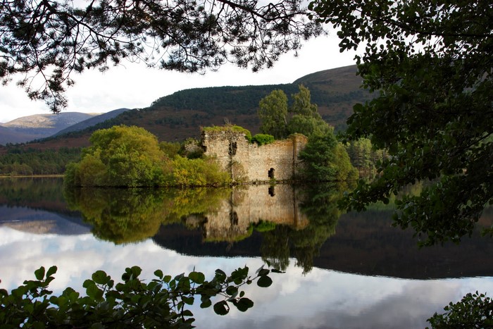 Ruins of Eilean Castle on a lake in Scotland