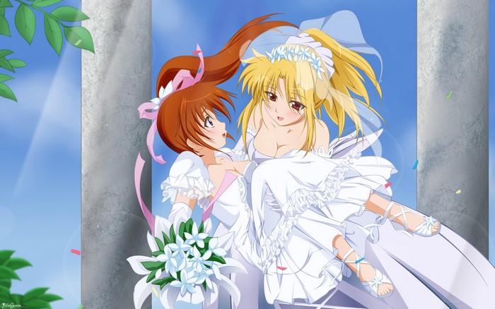Two brides in wedding dresses with bouquets