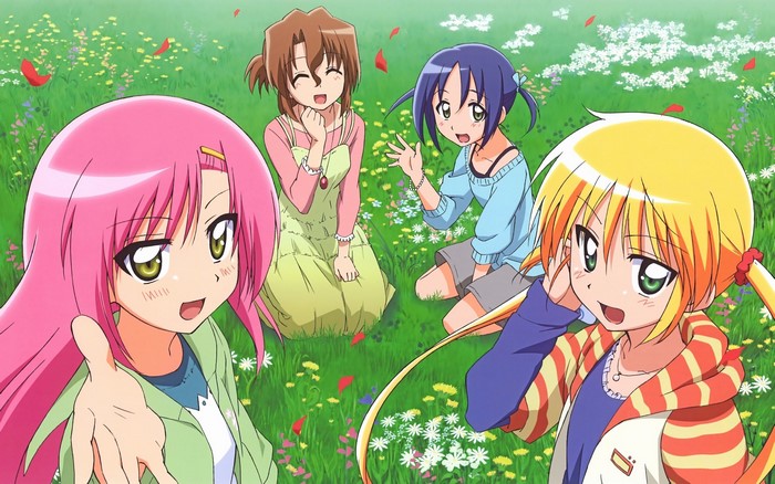 Four girls in a field of flowers