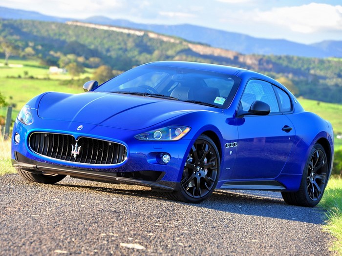 Blue Maserati GranTurismo parked on a road