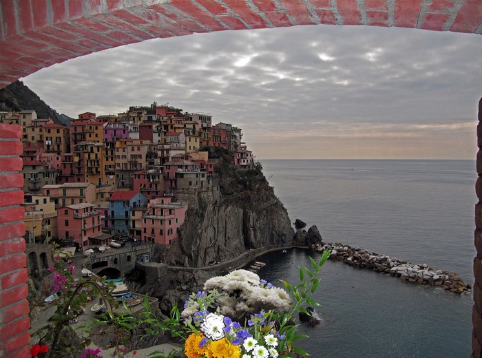 Colorful village on a cliff overlooking the sea in Italy