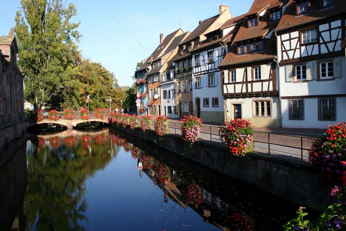 Colmar, France canal with half-timbered houses and flowers