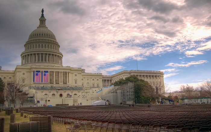 United States Capitol Building with flags and chairs