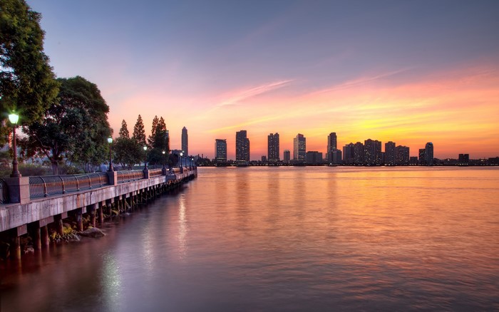 New York City skyline at sunset from a pier