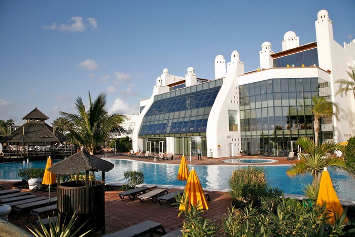 Resort with swimming pools and palm trees