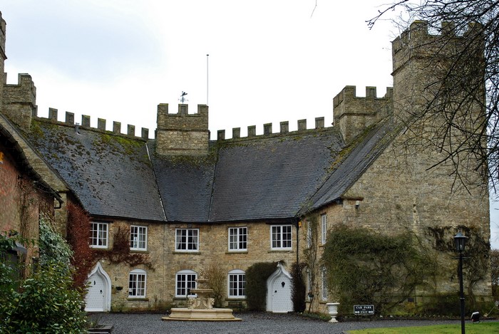 Castle-like building with crenellated battlements in the UK