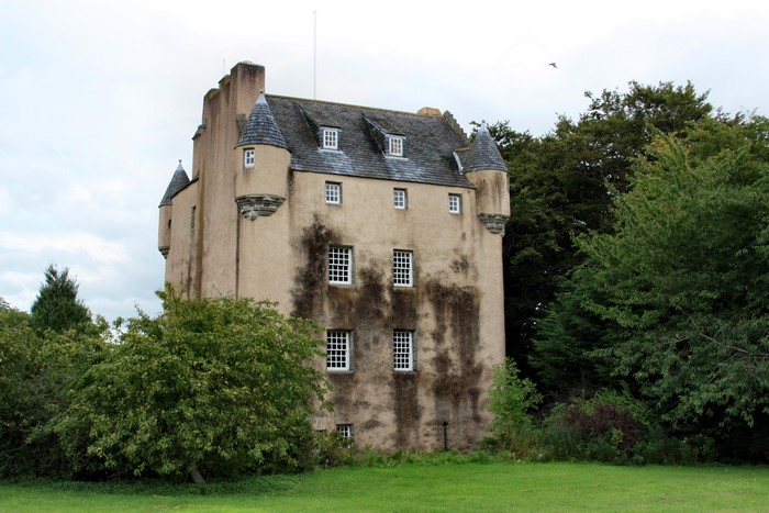 Tillycairn Castle surrounded by trees