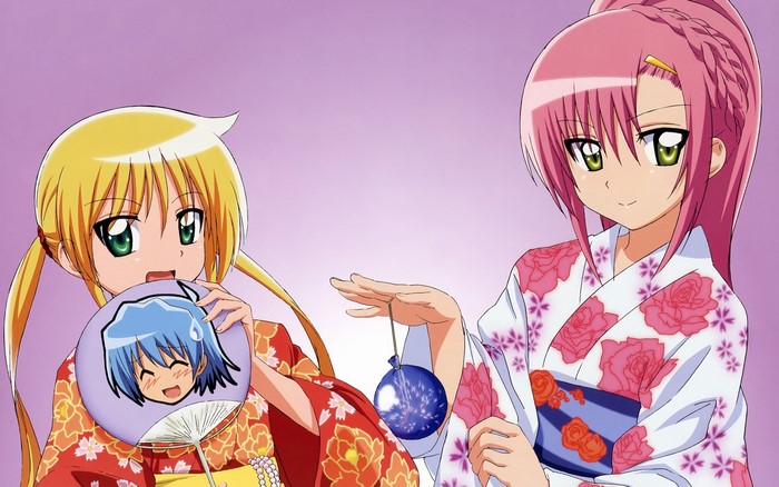 Two girls in yukatas with a fan and yo-yo