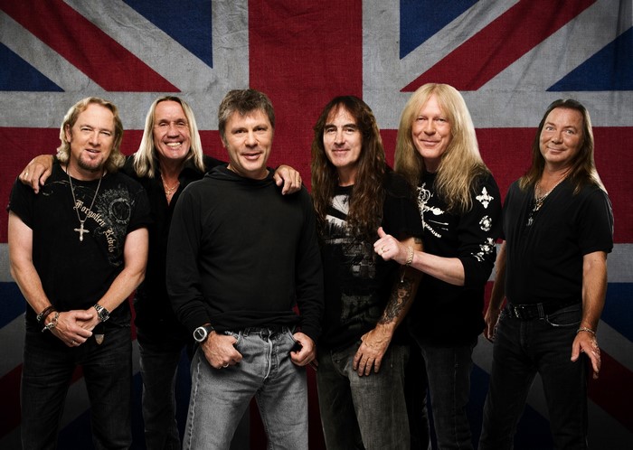 Iron Maiden band members in front of Union Jack flag