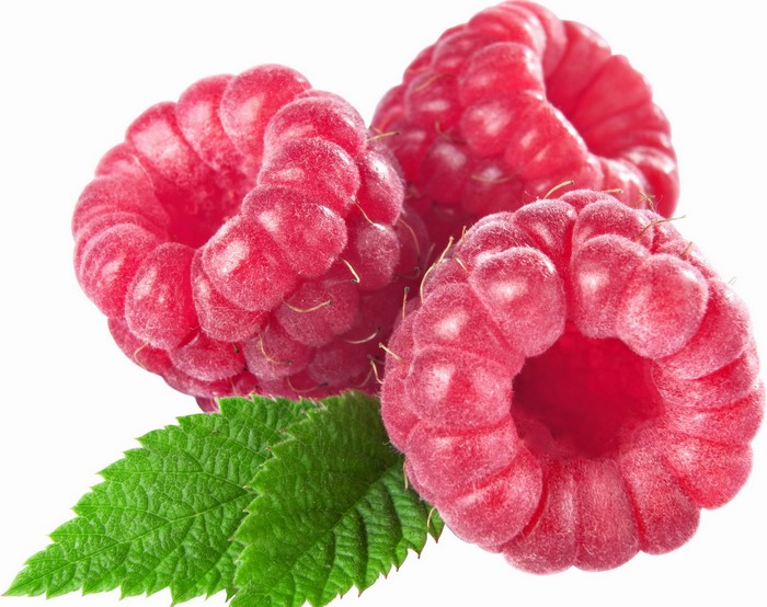 Three ripe raspberries with green leaves