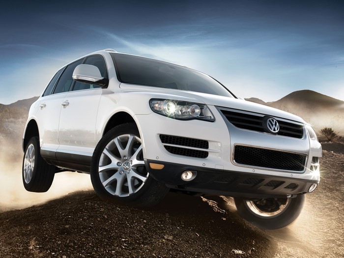 White Volkswagen Touareg driving off-road