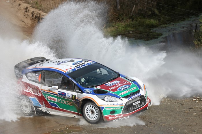 Ford Fiesta WRC car driving through water