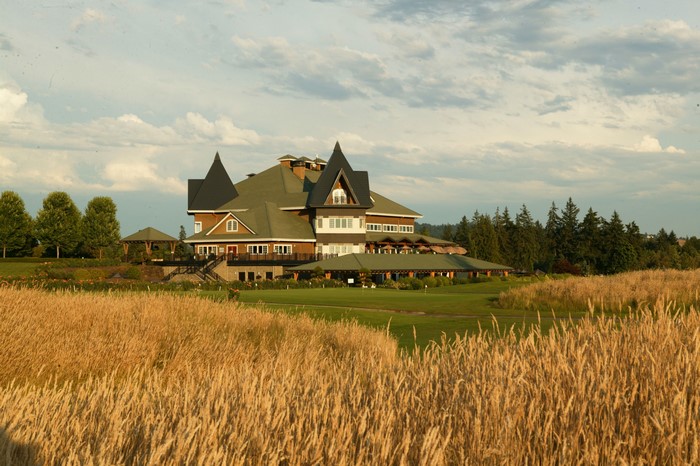 Large building on a golf course with tall grass