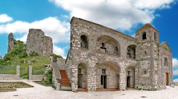 Stone church and castle ruins in Italy