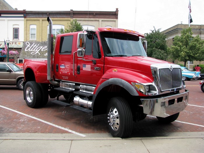 Red International CXT truck parked on brick street