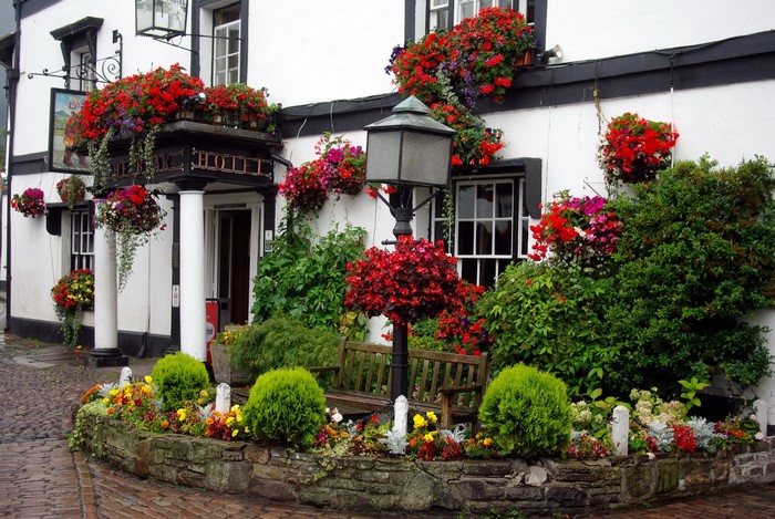 The Swan Hotel exterior with abundant flowers